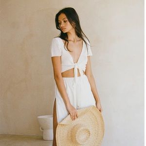 The Sabo Skirt Anuel Top loose crochet style knit in a cream hue. Size Small